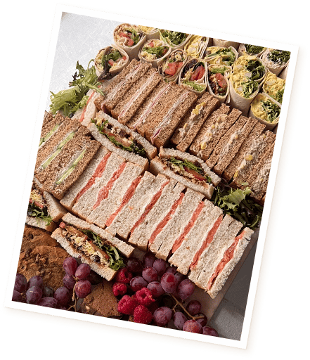 Little Grazey serving food to customers at an event