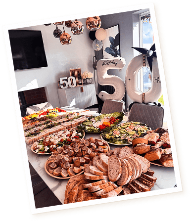 A buffet of meats and food prepared for a birthday celebration